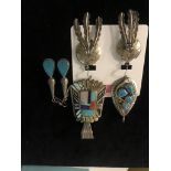 Navajo silver stone set pendants and earrings;