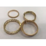 Four gold rings to inc an 18ct example