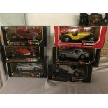 A box of boxed Burago cars