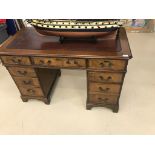 A mahogany leather topped twin pedastal desk