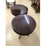 A pair of 20th century drum tables