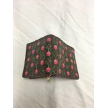 A Louis Vuitton cherry monogram wallet;