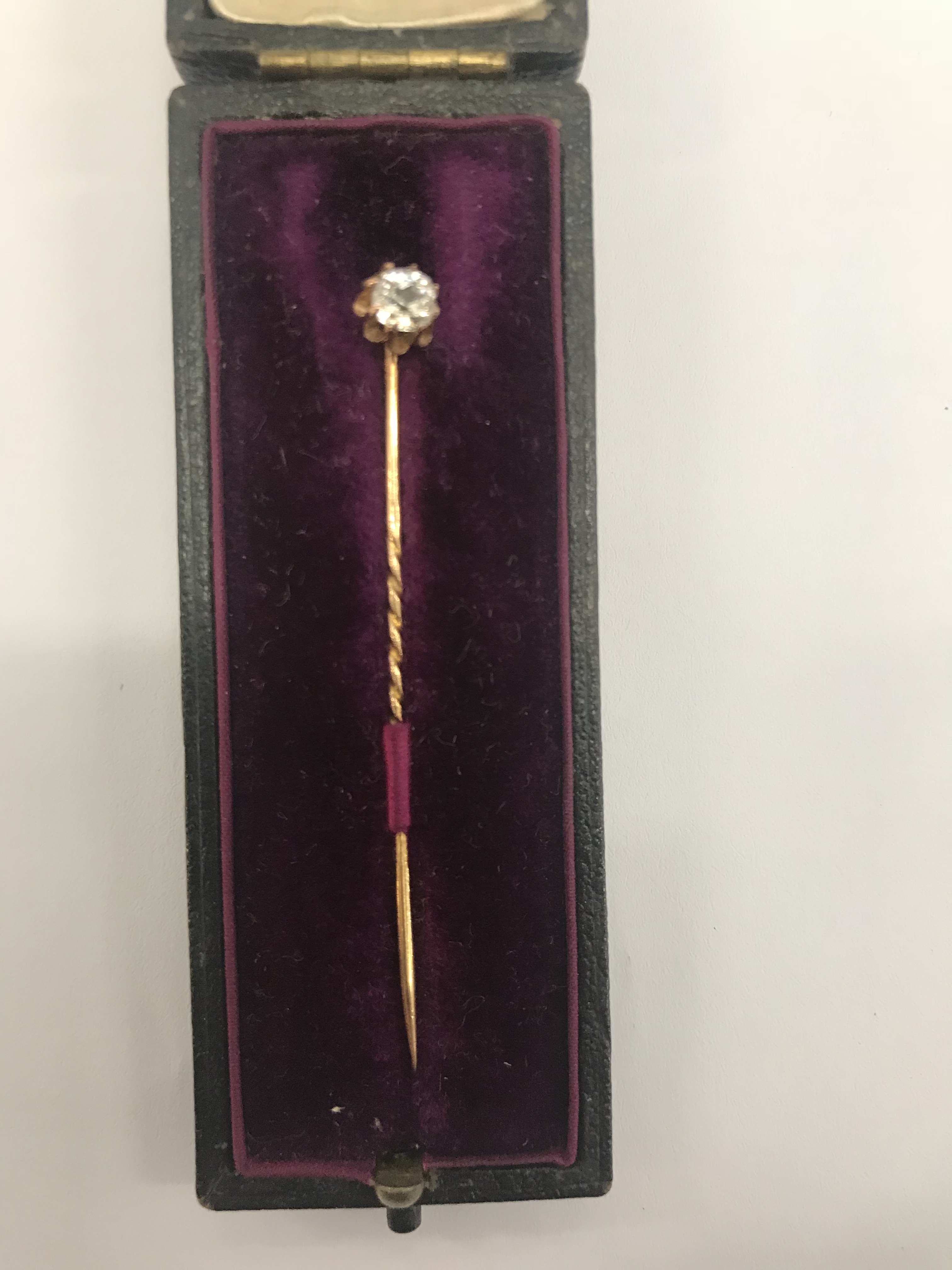 A diamond set stick pin