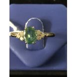 An 18ct diamond and emerald ring