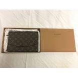 A boxed Louis Vuitton monogram pattern clutch bag;