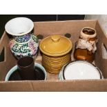 A box containing art pottery items