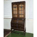 A bureau bookcase with leaded glass doors