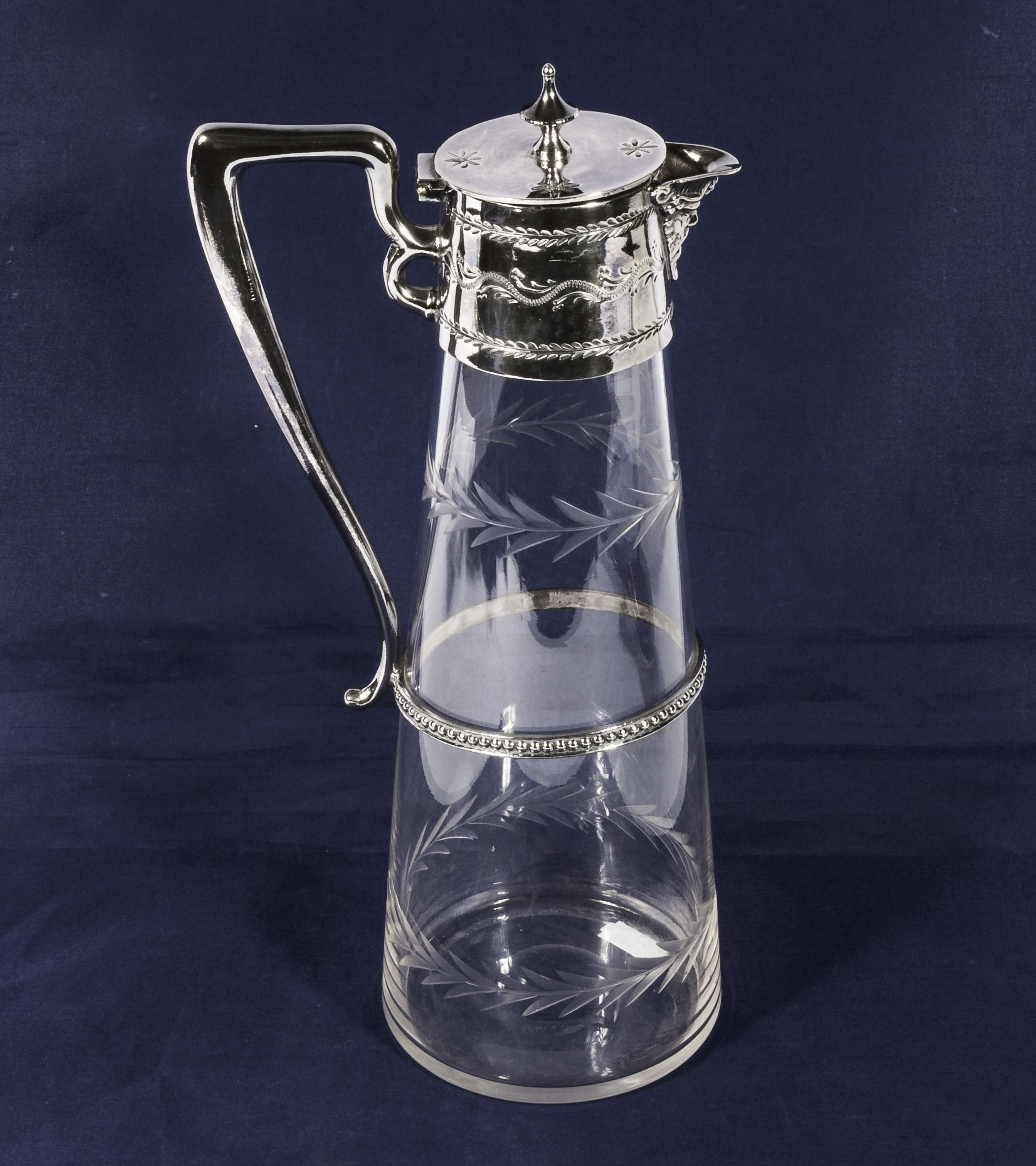 An etched glass and silver plated claret jug