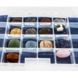 A collection of polished semi-precious/crystal palm stones, used in holistic therapy