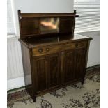 A small Edwardian side buffet with panelled doors and mirror back 107cm wide.