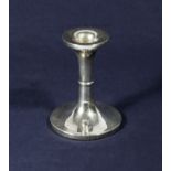 A silver candlestick 10cm tall