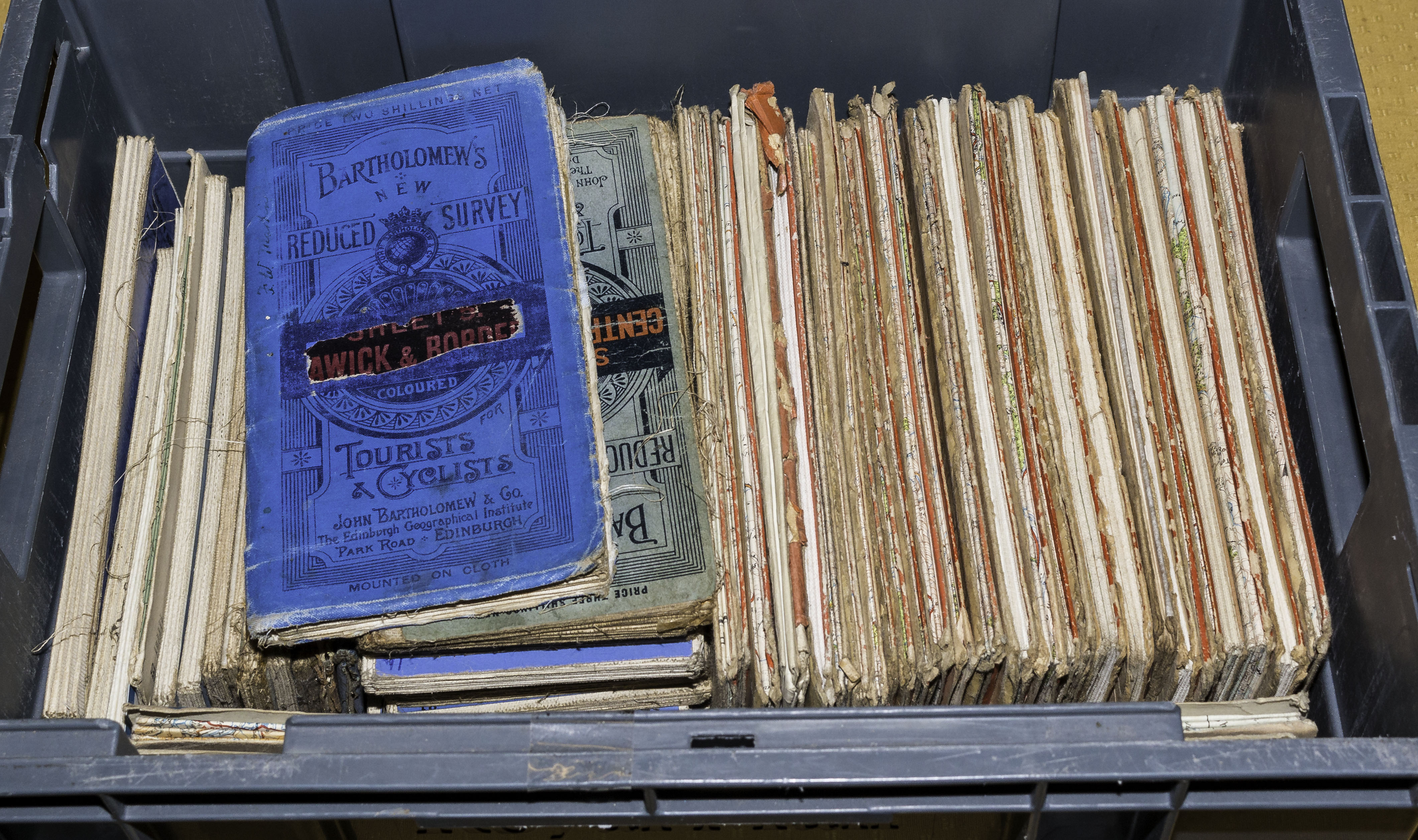 A box containing road maps of Scotland