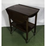 A mahogany tea trolley.