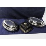 A pair of silver plated lidded tureens and a cheese dish