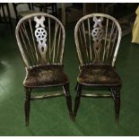 2 vintage wheel back chairs.