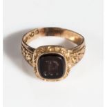 An 18ct gold cygnet ring set with an onyx