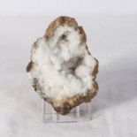 A part quartz crystal Geode with stand