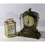 A vintage Schatz mantle clock and a carriage clock