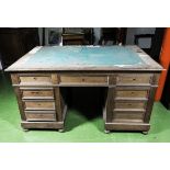 A double pedestal partners desk, distressed