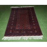 A red ground wool rug