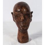 A late 19th century hardwood carving of a man's head