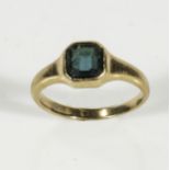 An 18ct gold cygnet ring set with a blue stone