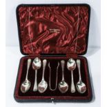 A boxed set of Walker & Hall silver teaspoons and sugar tongs, Chester marks