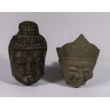 Two carved stone Buddha heads