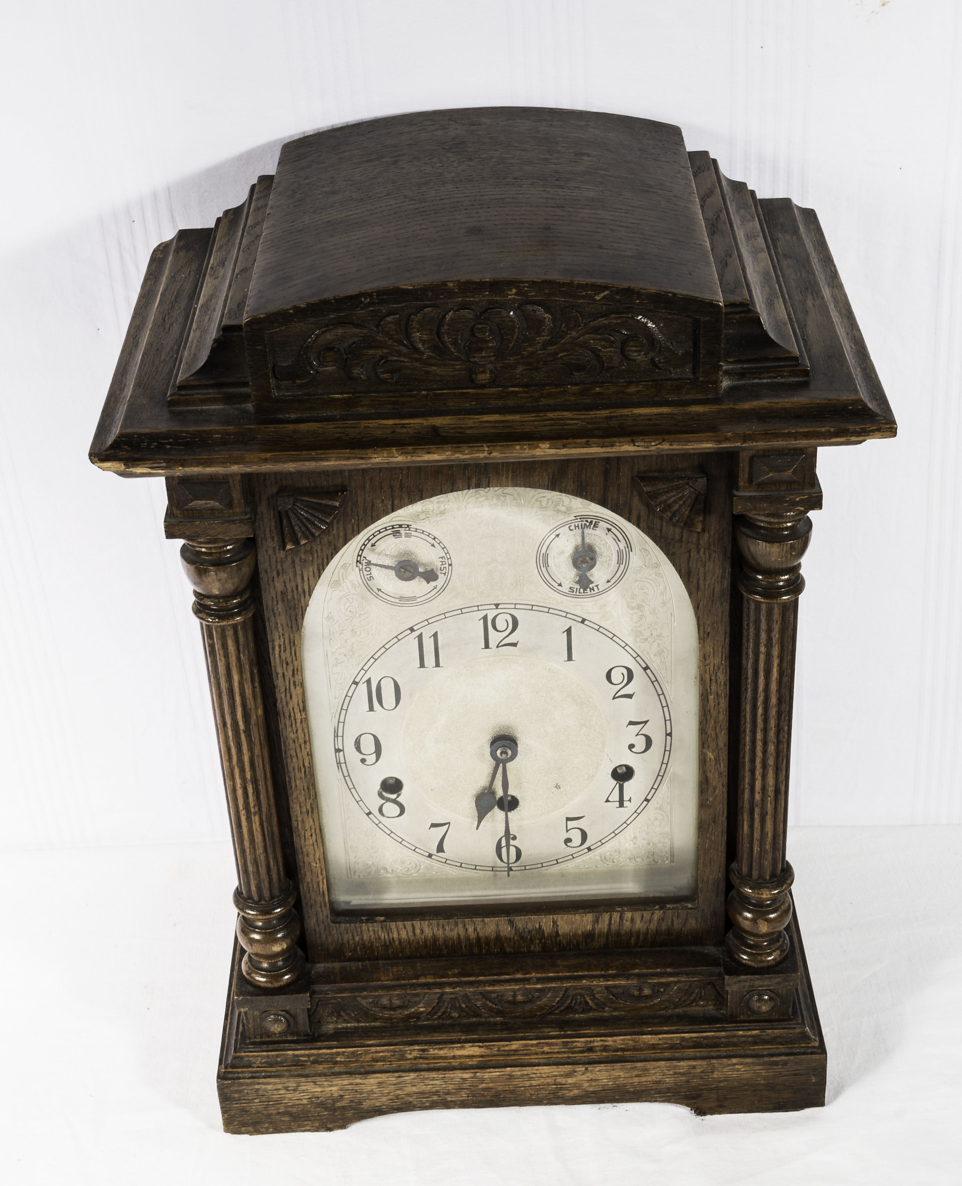 A Victorian oak cased bracket clock Westminster chime, silvered face