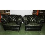 Two green leather Chesterfield armchairs