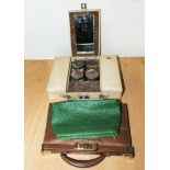 A vintage vanity case and two handbags