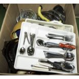 A box containing kitchen ware and cutlery