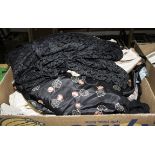 A box containing vintage clothing