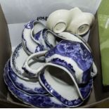 A box containing blue and white transfer print pottery