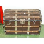 A brass bound travel trunk