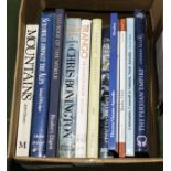 A box containing books relating to mountaineering