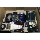 Three model cars and other small models