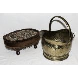 A footstool and a brass coal bucket