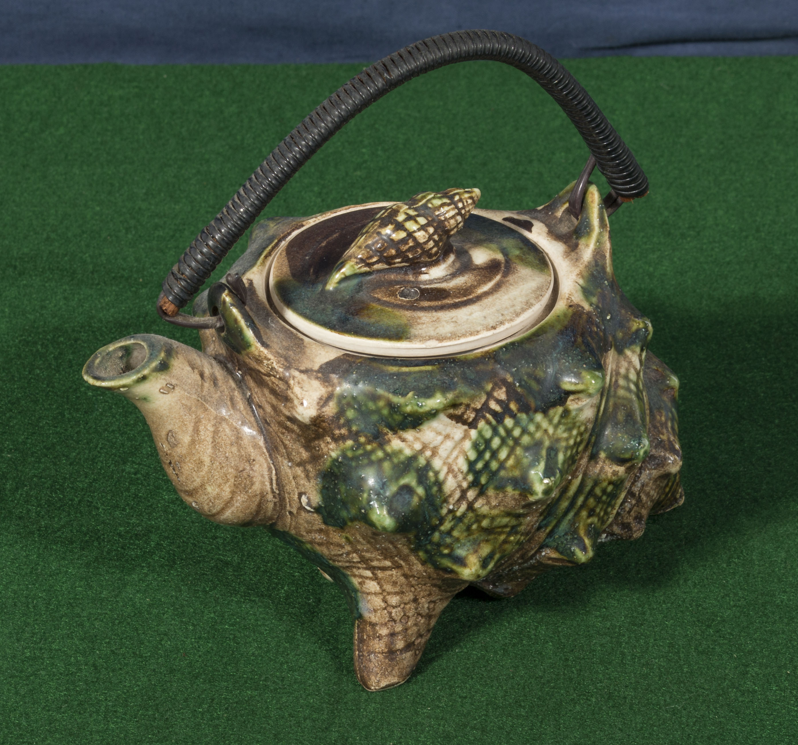 A Victorian teapot in the shape of a shell