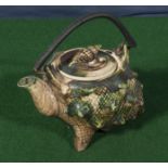 A Victorian teapot in the shape of a shell