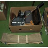 A box containing cine camera, badminton racquet and a tent