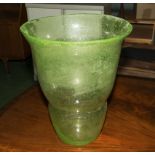 A large frosted green glass vase