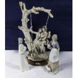 A figure group together with two Lladro style figure