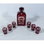 an etched ruby glass decanter and six glasses