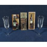 Two champagne glasses and three plaques