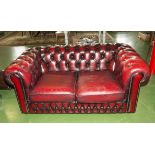 A two seater leather Chesterfield sofa