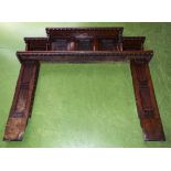 A Victorian carved oak fire surround.