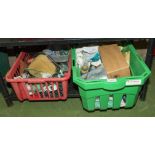 Two baskets containing assorted gardening items