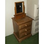 A pine bedside chest.