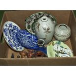 A box containing assorted pottery items